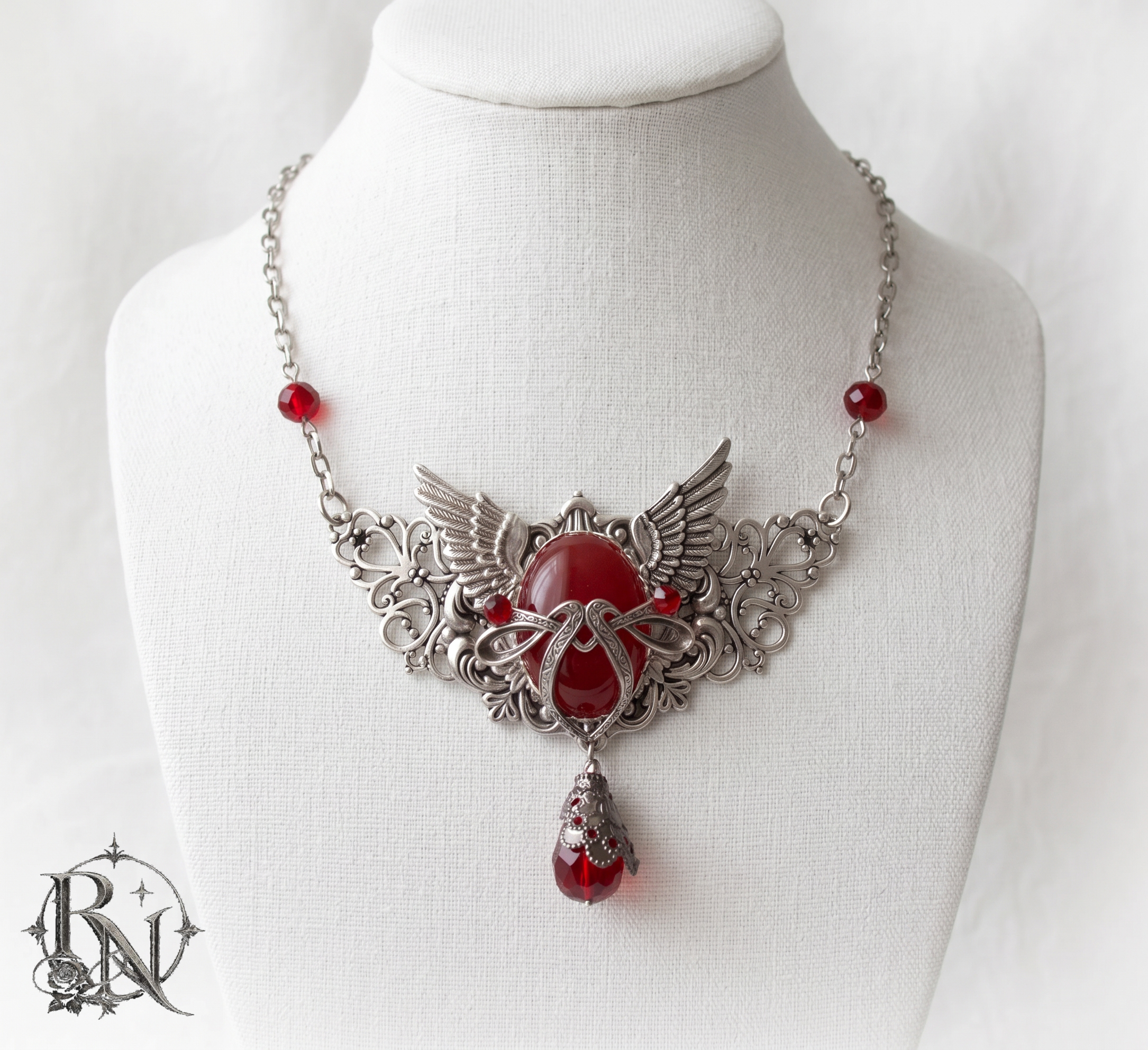 Gothic silver winged pendant with gem
